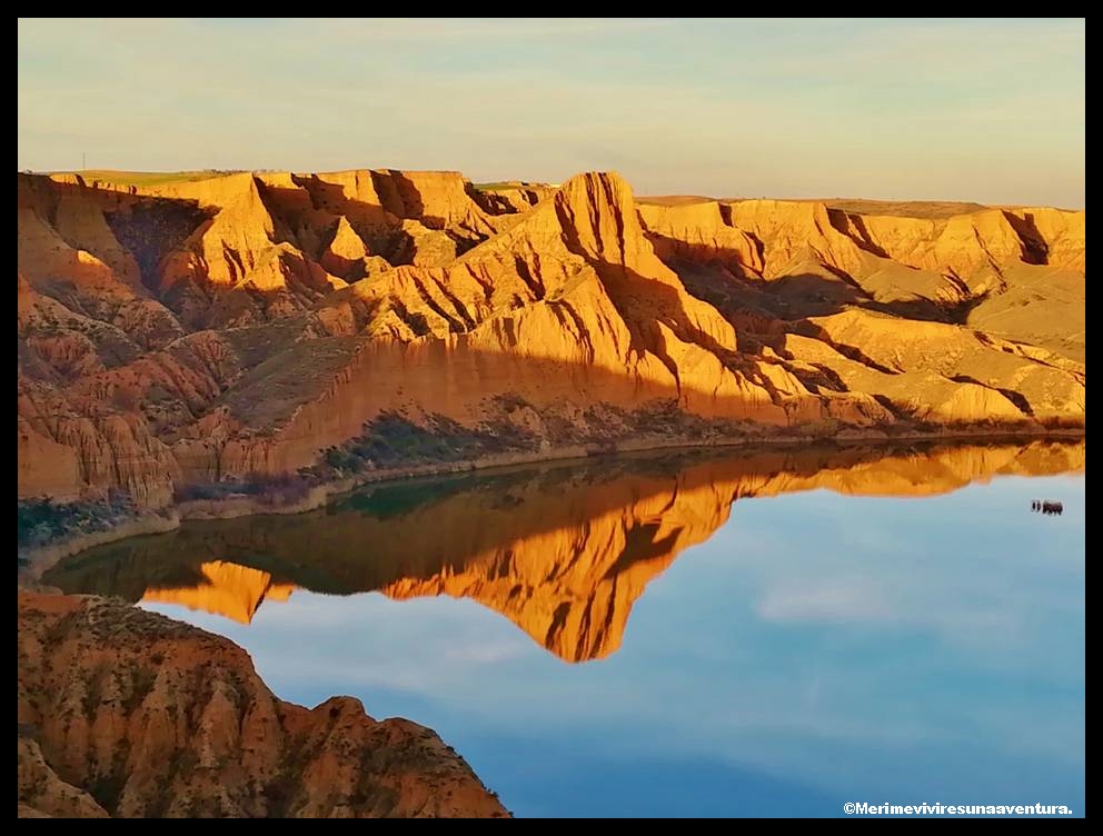 Barrancas de Burujón at sunset reflected in the Tagus reservoir